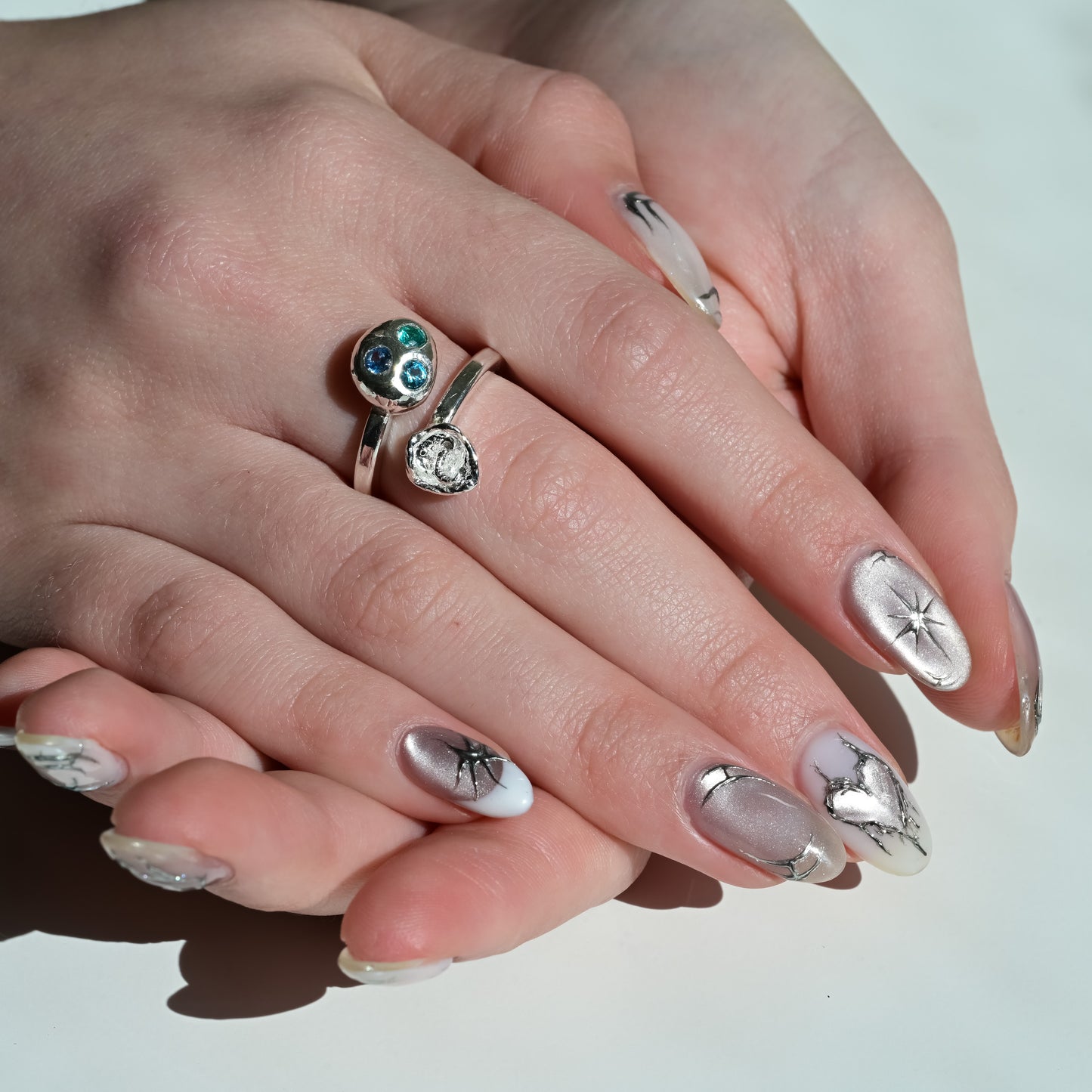 Alternate angle of Lilly - Melted Silver Ring blue sapphires