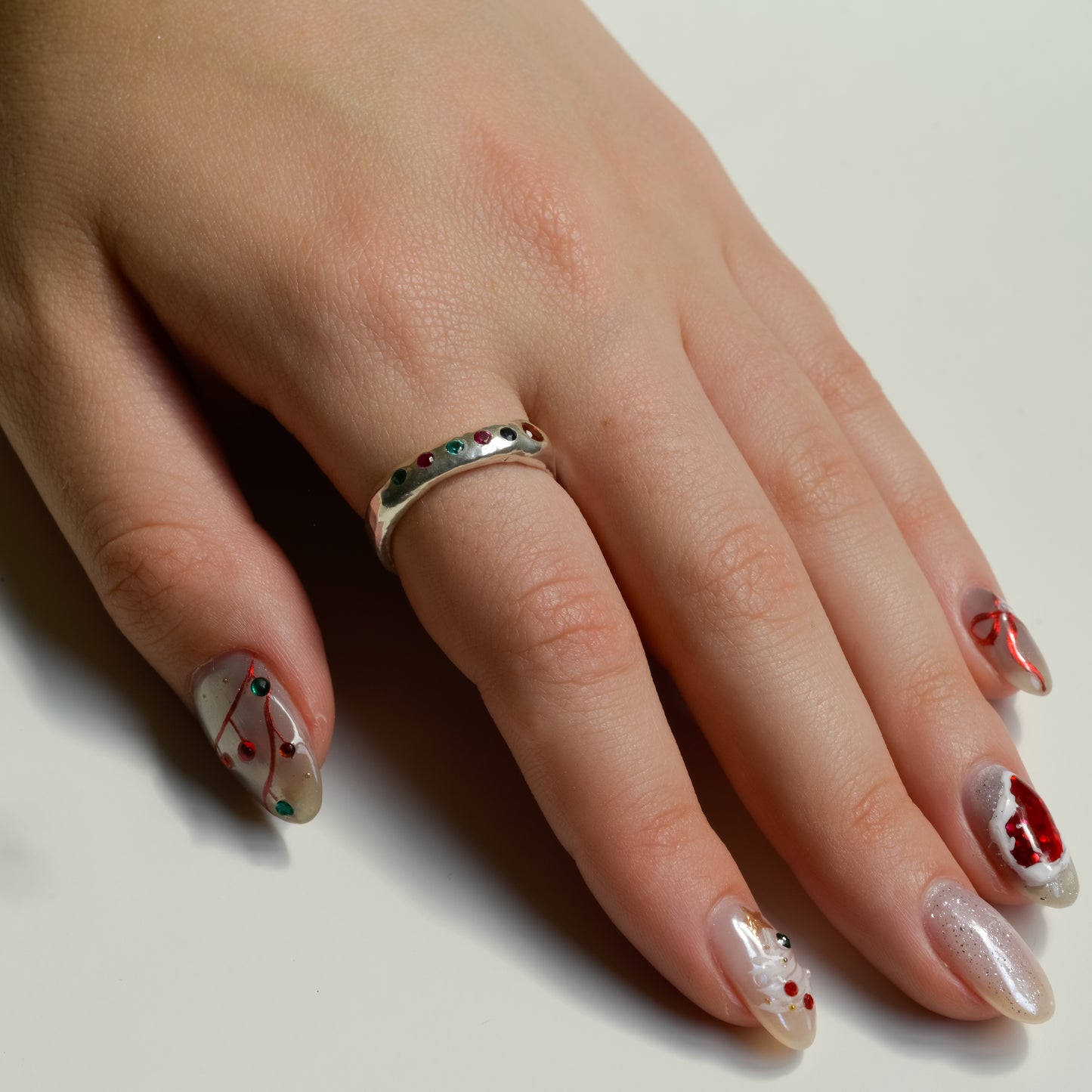 Worn view of Rainbow Dreams Fine Silver Ring Sapphires Garnet Emerald