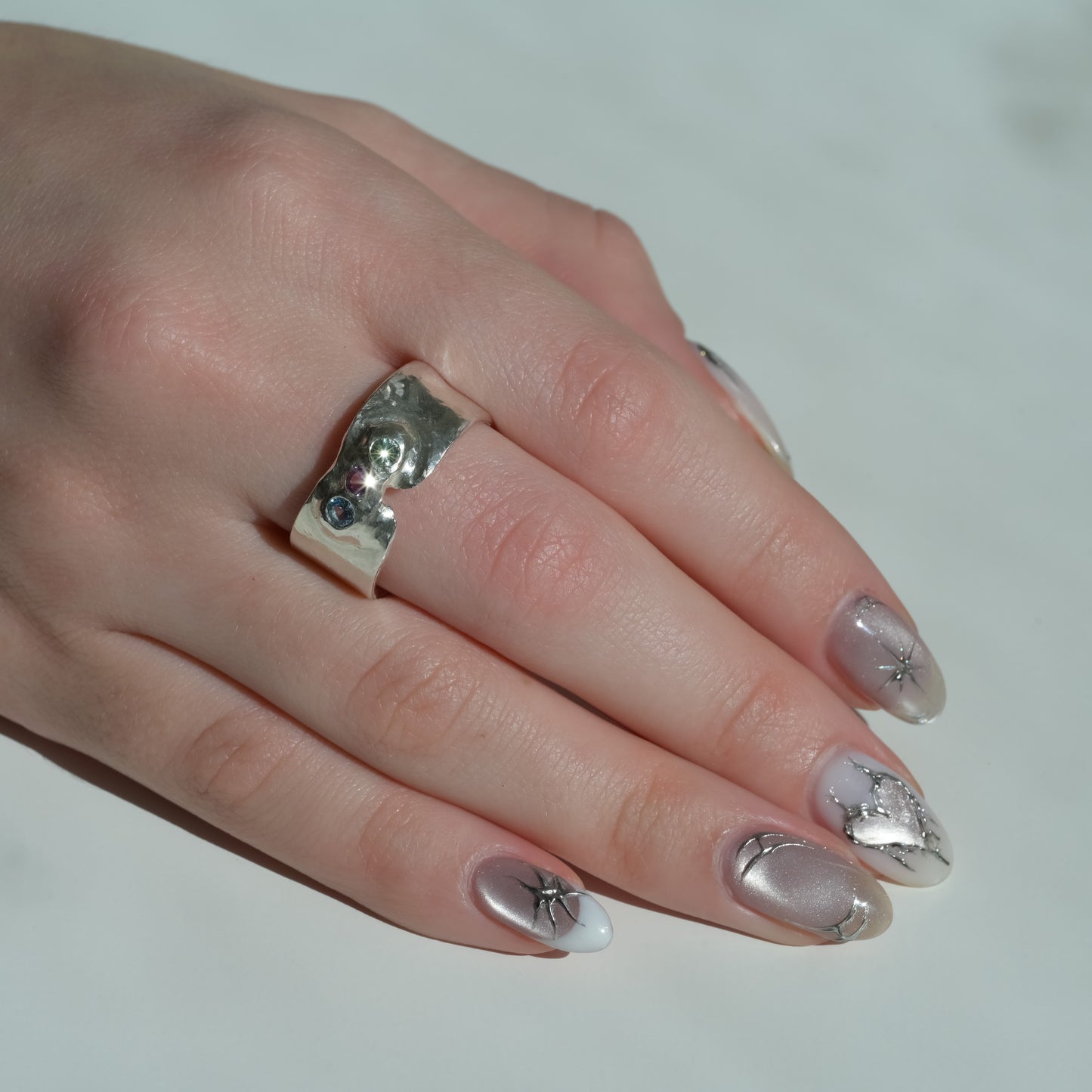 Alternate angle of Melted Silver Ring with sapphires Trinity Sky