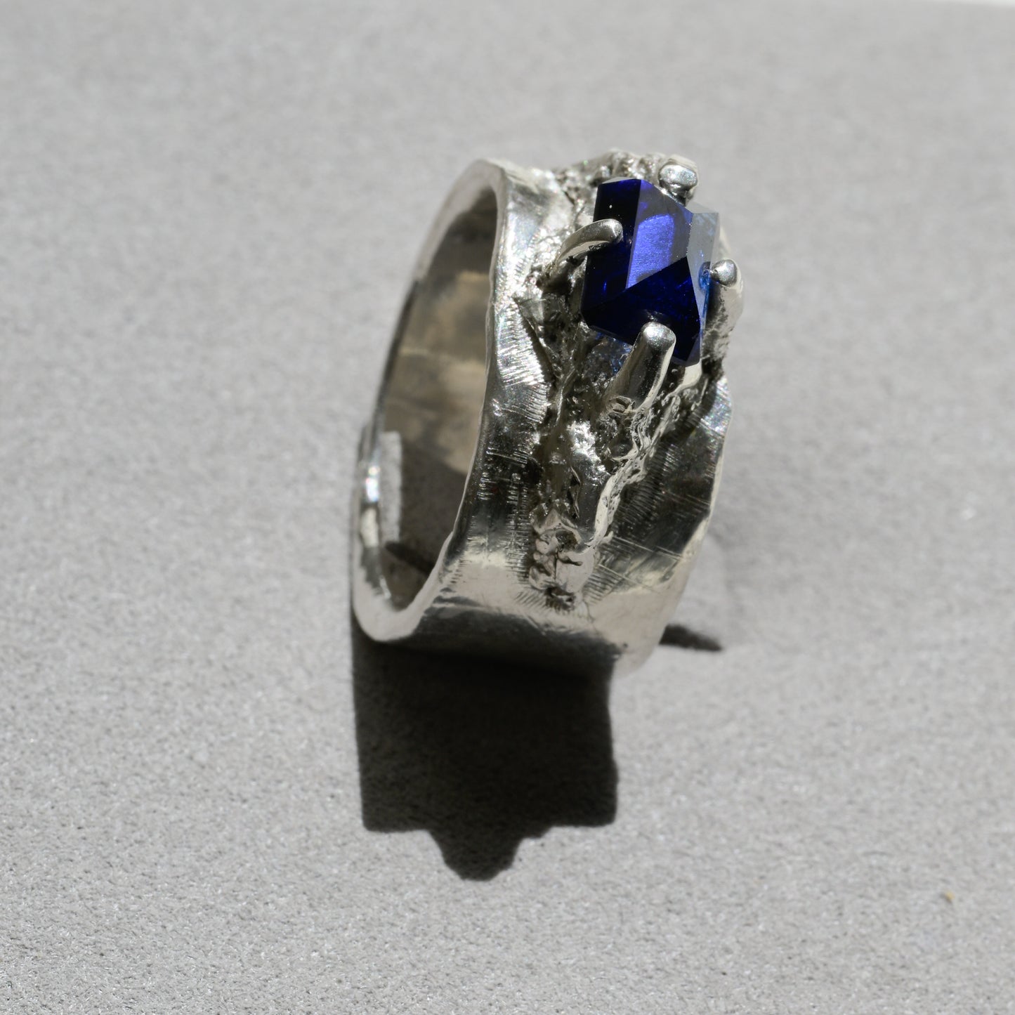 Detail close-up of Molten Silver Sapphire Ring - Fine Silver Statement Ring