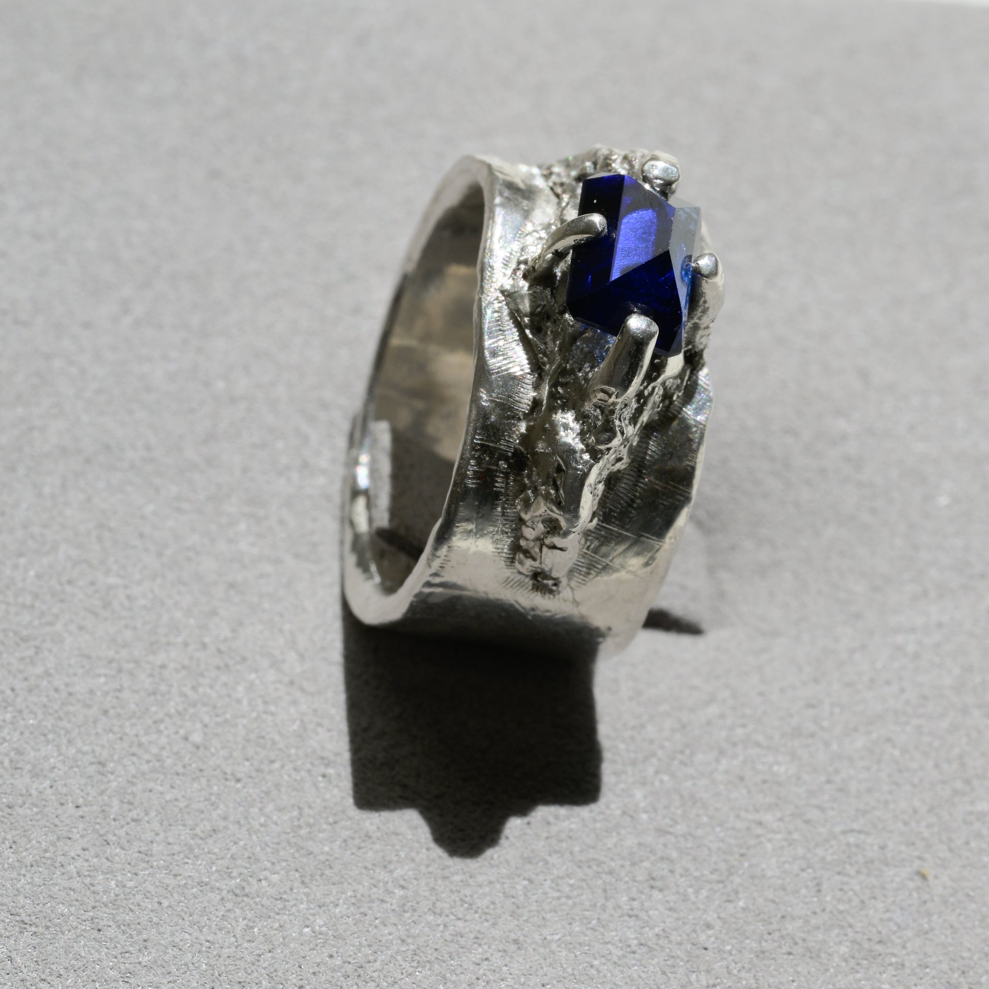 Detail close-up of Molten Silver Sapphire Ring - Fine Silver Statement Ring