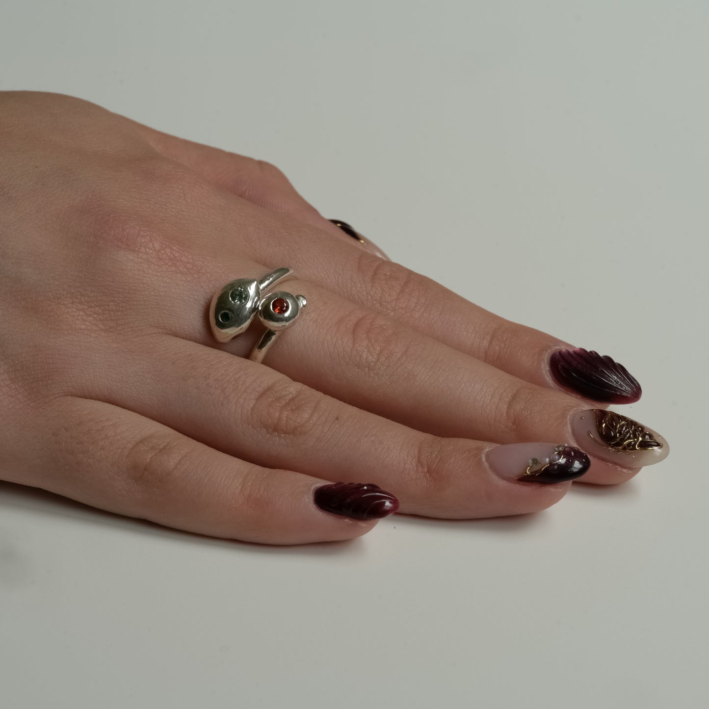 Worn view of Cosmic Cascade Ring - Fine Silver Sapphire & Paraiba Garnet Trio