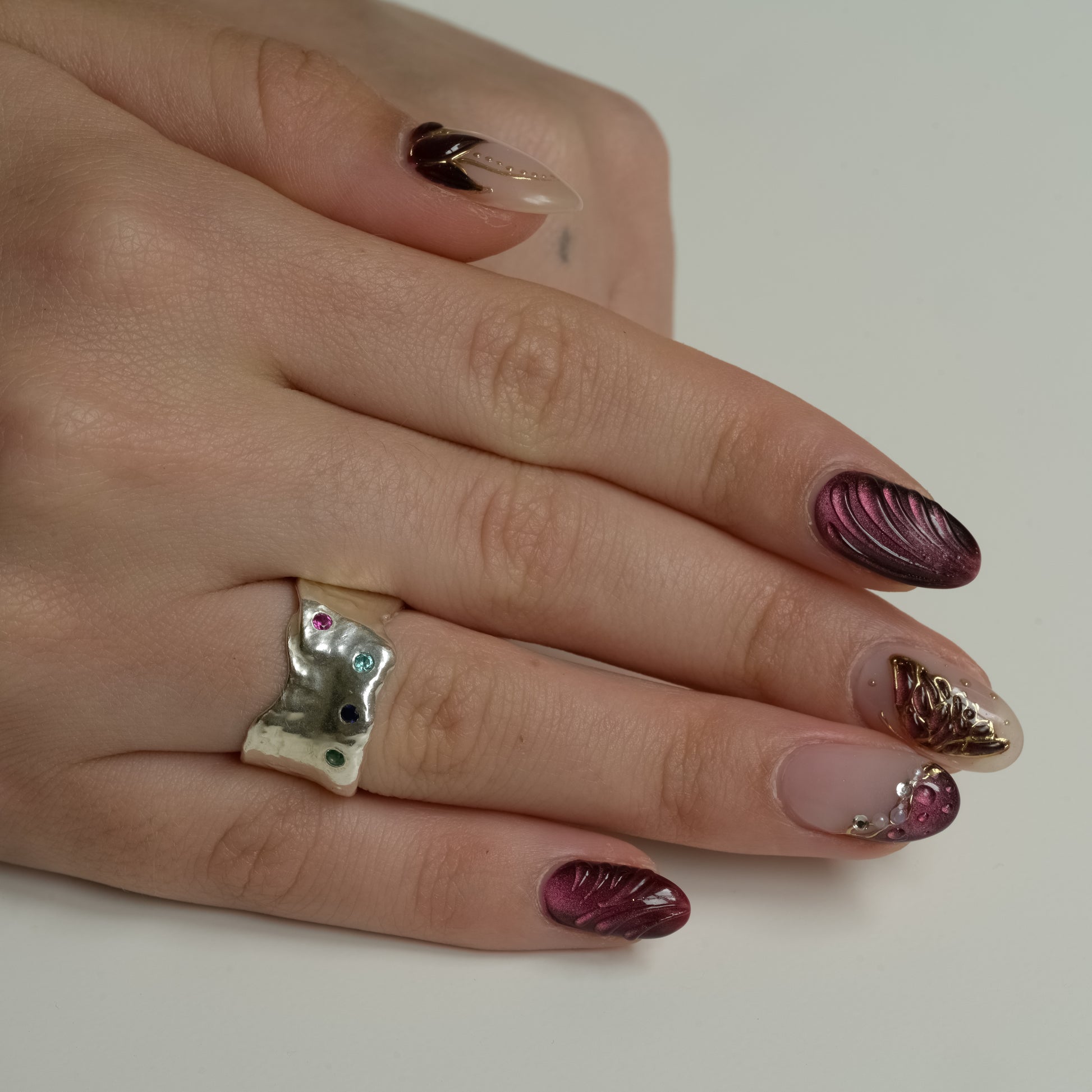 Side view of Cosmic Garden Ring - Fine Silver with Emerald Sapphire Garnet