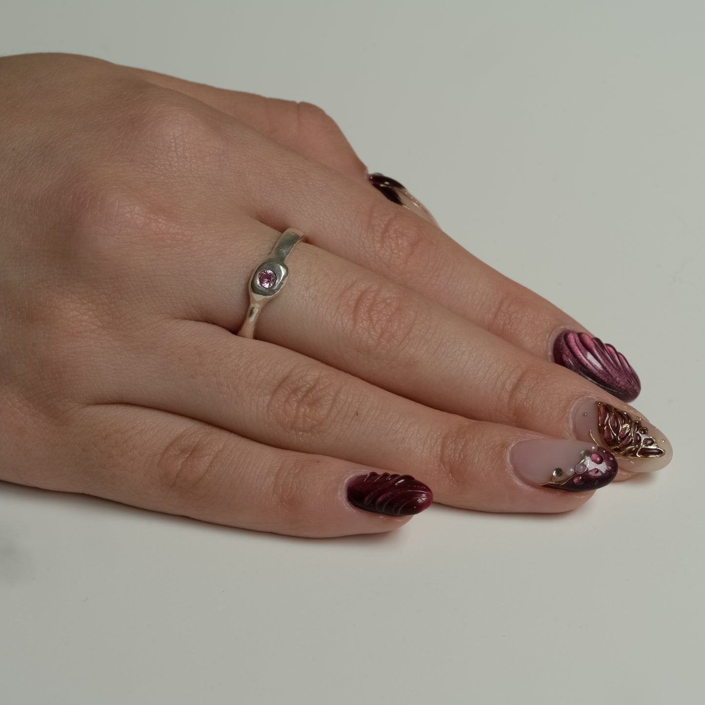 Side view of Pink Sapphire Fine Silver Ring - Melted Organic Band