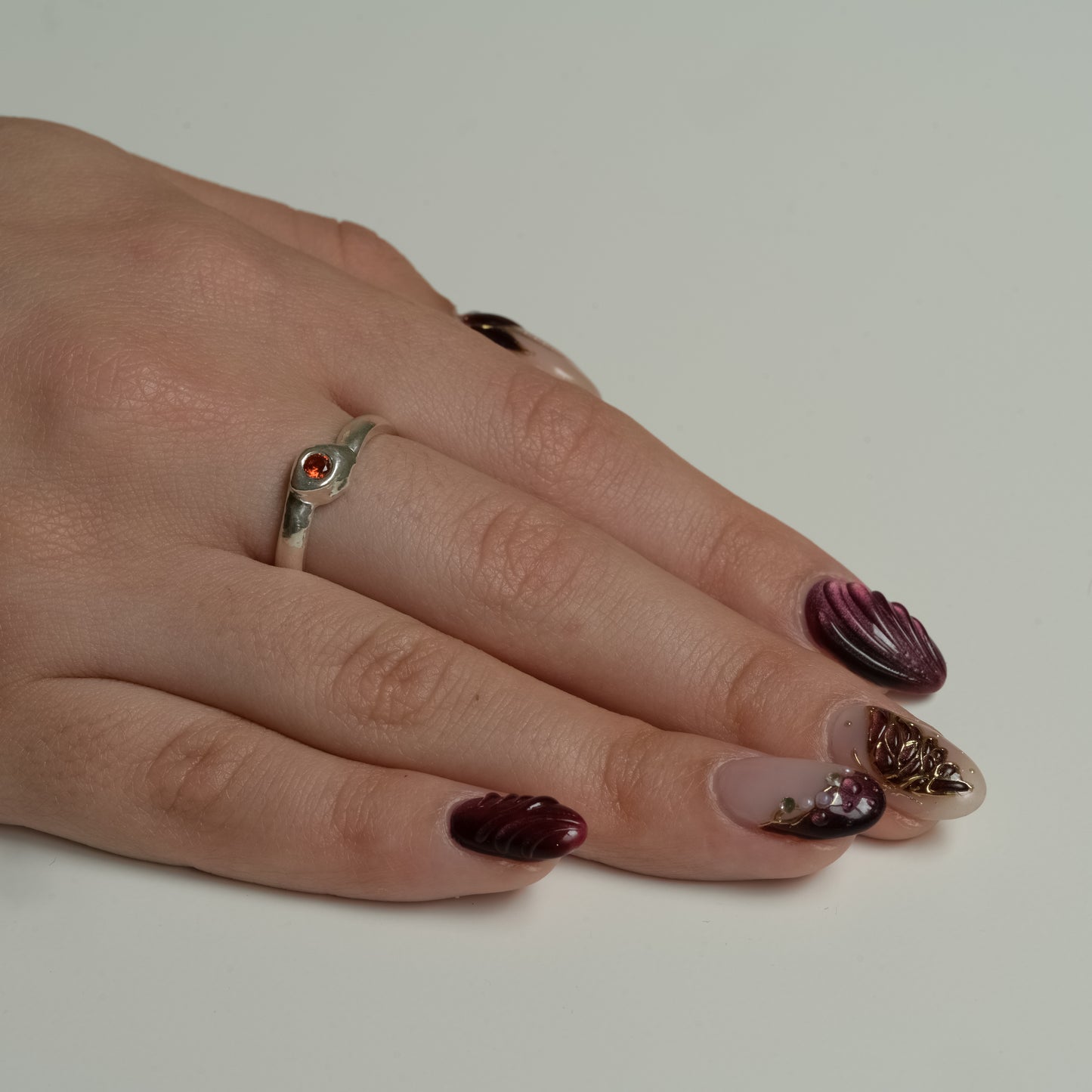 Side view of Orange Sunset Sapphire Ring in Fine Silver