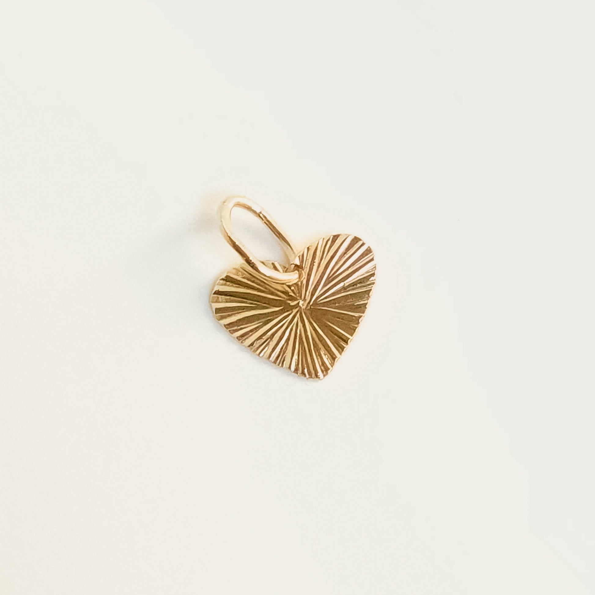 Side view of Gold Little Heart Pendant