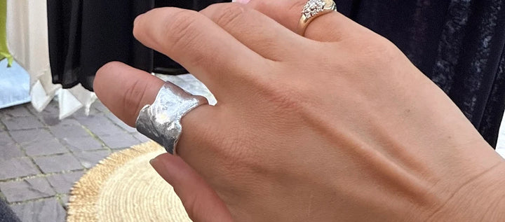 Customer photo: wide melted-silver ring worn on hand — review by Angela Yao