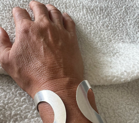 Customer photo: modern twisted silver cuff bracelet — review by Julie Trell