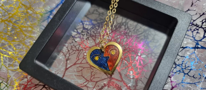 Customer photo: gold heart pendant with half-blue half-red champlevé enamel — review by Prabhakar Sravanthi