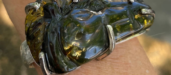 Customer photo: silver bangle with carved amber horse-head centrepiece — review by Rhia Gomes